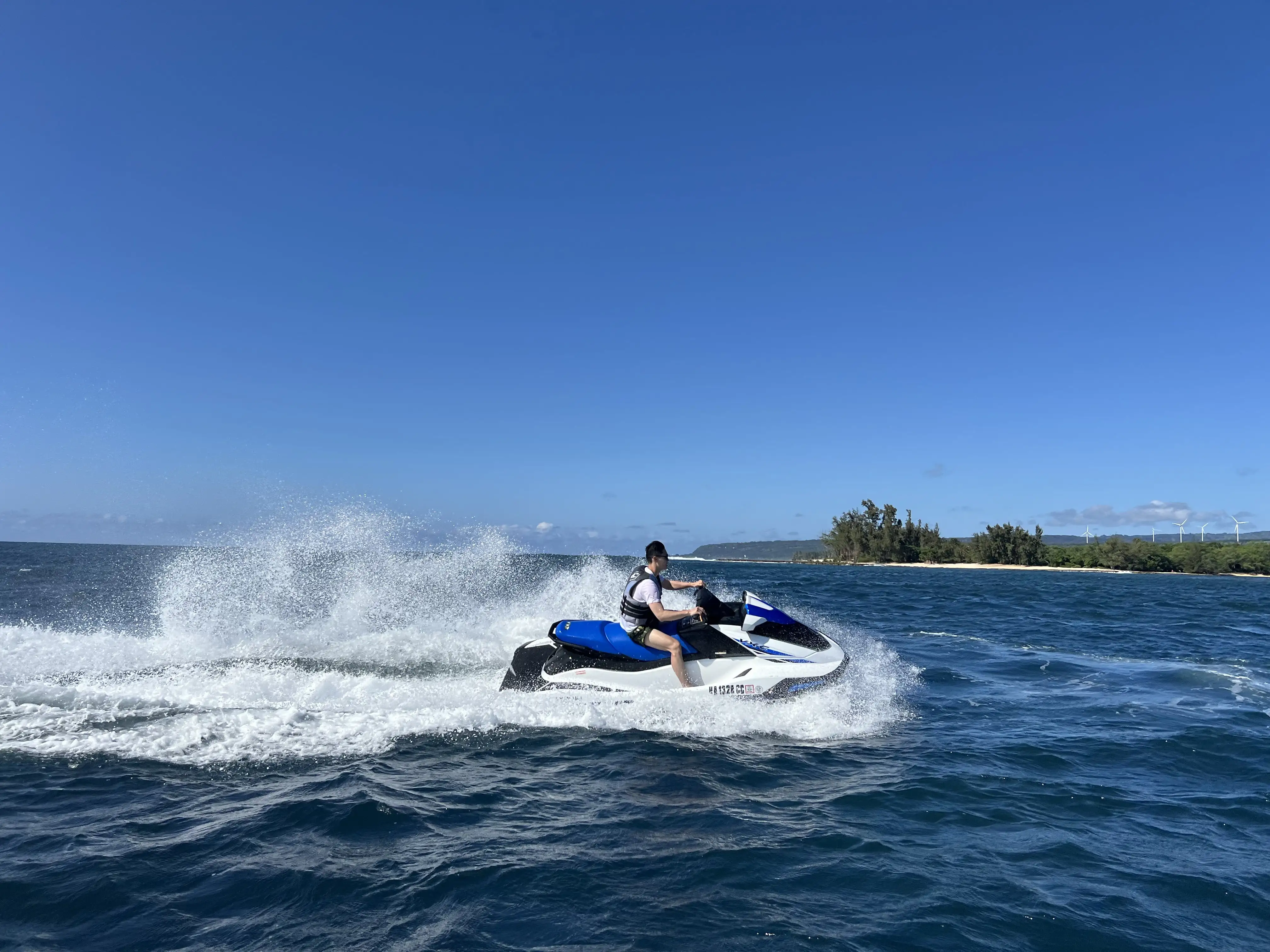 Jet ski riding the open ocean off Haleiwa